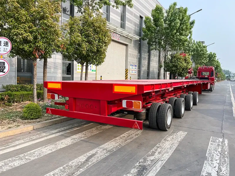 Custom wind blade truck trailer with telescopic deck and large rotating hydraulic lifting adapter at the factory before shipment to Brazil Custom wind blade truck trailer with telescopic deck and large rotating hydraulic lifting adapter at the factory before shipment to Brazil